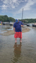 Load and play video in Gallery viewer, Boater using the Sand Saber XL 8FT shallow water anchor pole to secure a boat in shallow water at a sandbar

